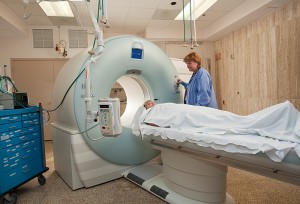 <p>Sabine Bredefeld, lead CT/MR technologist, operates the Health Center’s new computerized tomography (CT) scanner. Photo by Lanny Nagler</p>