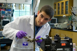 <p>Honors student David Lindsay at work in a chemistry lab. Photo by Lanny Nagler</p>