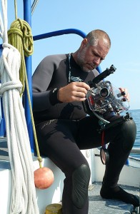 <p>Diving safety officer Jeffrey Godfrey prepares an underwater camera for a dive. Photos supplied by Jeffrey Godfrey</p>