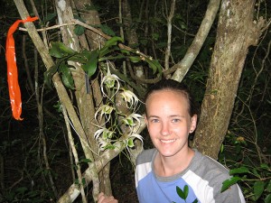 <p>Kathryn Theiss, a Ph.D. student in ecology and evolutionary biology, with an orchid in Madagascar. Photo supplied by Kathryn Theiss</p>