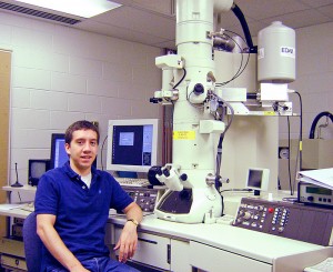 Jonathan Winterstein with a transmission electron microscope. Photo supplied by School of Engineering