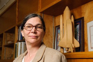<p>Mary Musgrave, professor of plant physiology, with a model of the space shuttle in her office.  Photo by Peter Morenus</p>