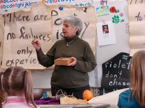 <p>Davyne Verstandig teaches poetry to first and second graders at Kent Center elementary school. Photo by Linda Miller</p>