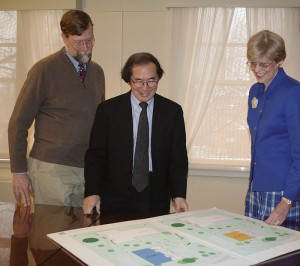 <p>Architects Whit Iglehart, left, and Tai Soo Kim discuss plans for the Nursing School's new Widmer Wing with Dean Anne Bavier. Photo by Barbara Slater</p>
