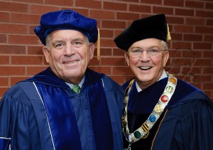 <p>Lawrence McHugh, left, chairman of the Board of Trustees, with President Michael Hogan before the Convocation ceremony at Gampel Pavilion. Photo by Peter Morenus</p>