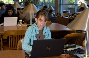 <p>Ashley Fuller, a sophomore biology major, studies online at Homer Babbidge Library. Photo by Frank Dahlmeyer</p>