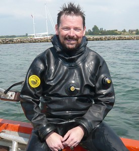 <p>David Robinson, a graduate student in anthropology, on a boat at Avery Point. Photo supplied by David Robinson</p>
