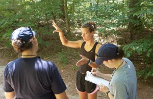 <p>Katrina Gustafson, center, a runner, speaks with Rebecca Lopez and Brooke Bailey during a dehydration study. Photo by Sean Flynn</p>