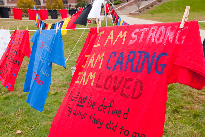 <p>T-shirts decorated by sexual assault survivors or their friends are displayed on the South Green as part of 'The Clothesline Project' during Domestic Violence Awareness Week. Photo by Frank Dahlmeyer</p>