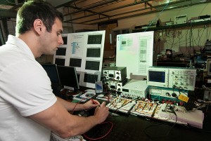 <p>Robert Croce, a Ph.D. candidate, works in the implantable glucose center lab. Photo by Frank Dahlmeyer</p>