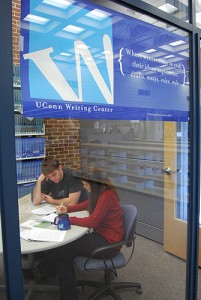 <p>A tutor works with a student in the Writing Center. Photos by Suzanne Zack</p>
