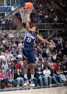 <p>All-American Maya Moore competes with the men's basketball players in the dunk contest. Photo by Stephen Slade</p>