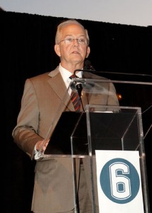 <p>President Michael Hogan addresses the gathering. The number 6 was Jasper Howard's uniform  number. Photo by Stephen Slade</p>