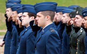 <p>UConn ROTC cadets salute during the retiring of the colors.</p>