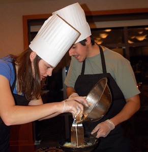 <p>Regan Grote and Josh Madore prepare a dish in the Top Chef @ UConn competition on Nov. 2. Photo by Gail Merrill </p>