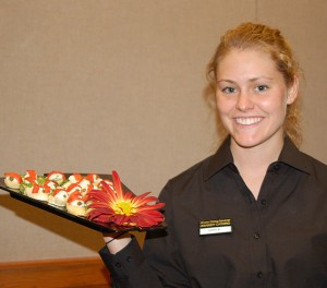 <p>Caitlin Bowen, a fifth semester civil engineering major who also works with Dining Services, displays a dish. Photo by Gail Merrill </p>