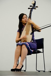 <p>Celine Yan performs on the pipa, a four-stringed Chinese instrument.</p>