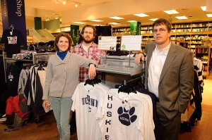 <p>From left, Shareen Hertel, lChris Jeffords, and Lyle Scruggs with a display of fair trade and union-made clothing at the UConn Co-op. Photo by Peter Morenus</p>