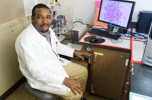 <p>John Ngunjiri, a Ph.D. student in molecular and cell biology, in his lab. Photo by Daniel Buttrey</p>