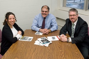 <p>From left, political science professors Evelyn Simien, Cyrus Ernesto Zirakzadeh, and Jeffrey Ladewig, with issues of the journal Polity. Photo by Daniel Buttrey</p>