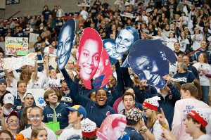 <p>Student fans display cutouts of members of the women’s basketball team. Photo by Peter Morenus</p>
