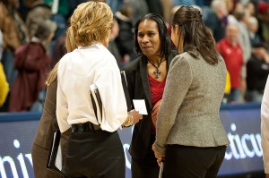 <p>Jamelle Elliott meets with Chris Dailey, left, associate head coach of women’s basketball. Photo by Peter Morenus</p>