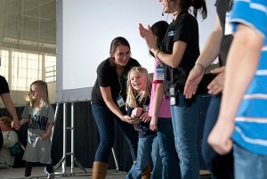 <p>Children from the Connecticut Children's Medical Center get on stage to dance and celebrate at UConn's HuskyTHON. Photo by Lauren Cunningham</p>