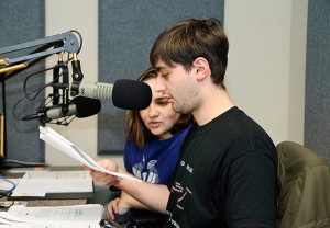 <p>Justin Miller, foreground, a junior classics and ancient Mediterranean studies major, and Corinne Goodman, a freshman animal sciences major, act in the WHUS radio drama City of Stones. Photo by Jessica Tommaselli</p>