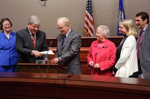 <p>Chancellor Marc Herzog, second from left, and President Michael Hogan exchange signed documents at a press conference at the state capitol for the signing of an agreement to expand the guaranteed admission of Connecticut community college students to the University of Connecticut. At left is Linda Klein, associate dean of business. Right of Hogan are State Sen. Mary Ann Handley, Rep. Roberta Willis, and Rep. William Hamzy. Photo by Peter Morenus</p>