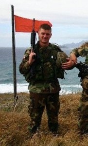 <p>Joel Angle, '09, at a firing range in Oahu, Hawaii, when he was in the U.S. Army. Photo supplied by Joel Angle</p>