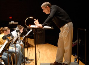 <p>Professor Jeffrey Renshaw leads a rehearsal of the UConn Wind Ensemble.</p>