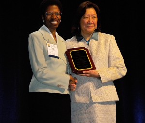 <p>Mary Romney, left, assistant professor in the International Teaching Assistants Program at the Institute for Teaching and Learning, receives the James Alatis Award for Teachers of English to Speakers of Other Languages Inc. (TESOL). The award was presented by Shelley Wong, past president, on March 25 at the organization's annual convention in Boston. Photo by Catherine Ross</p>