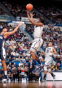 <p>Kalana Greene drives down the lane to score one of her 15 points to help the Huskies beat Notre Dame as part of the team’s historic 71st consecutive win in the Big East Championship at the XL Center in Hartford. Photo by Stephen Slade</p>