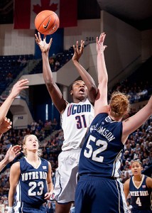 <p>Tina Charles scores one of her 16 points as part of UConn’s 71st consecutive win, an NCAA record for women’s basketball, in the Big East Championship at the XL Center in Hartford. Photo by Stephen Slade </p>