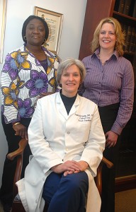 <p>First Among New Group of Doctorates: (from left to right) Victoria Odesina, Karen Myrick and, seated, Paula McCauley, will be among the first class to graduate this May from a new doctorate program in nursing practice. Photo by Janine Gelineau</p>