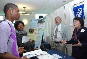 <p>Professors Jon Greenshields and Ruth Siomons speak with JB Aliyu and his mother, Emialiyu, at the Computer Science and Engineering information table in the ITE building during Open House. Photo by Margaret Malmborg </p>