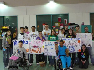 <p>UConn students and patients at Shriners Hospital in Philadelphia display signs from one of the activity stations. Photo supplied by the Office of Community Outreach</p>