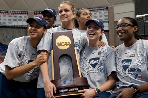 <p>Members of the UConn Women's Basketball team display the championship trophy during the UConn Women's Championship Pep Rally at Gampel Pavilion. Photo by Frank Dahlmeyer</p>