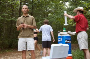 <p>Douglas Casa, left, associate professor of kinesiology, conducting a research project on dehydration in athletes. Photo by Sean Flynn</p>