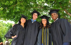 <p>Jen Pagano, left, Michael Surace, Christina Powers and Kareem Ayodeji pose for a photo before the CLAS Commencement ceremony at Gampel Pavilion. Photo by Peter Morenus</p>