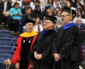 <p>Board of Trustees Distinguished Professors Harry Frank, left, Jeffrey Fisher and Johann Peter Gogarten are recognized during the CLAS Commencement ceremony at Gampel Pavilion. Photo by Peter Morenus</p>