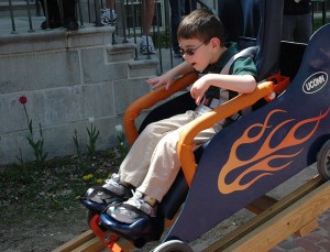 <p>Joey rides the slide ... the automated retracting coaster slide created  by students in the school of engineering. Photo by Margaret Malmborg</p>