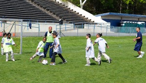 <p>Students from three Hartford schools play Soccer during the Husky Sport "Read and Raise Olympic Event". Photo by Jessica Tommaselli</p>