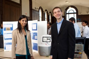 <p>Electrical Engineering students Juby Thomas-Thengumthyil and Sean Tierney pose with their senior design project, "Solar Powered Cooler." Juby, Sean and fellow student Brandon McCall (EE) developed a solar and battery-powered cooler for keeping food and beverages cool. The students presented their prototype during the School of Engineering's Senior Design Demonstration day held in the Wilbur Cross building on Friday, April 30. Photo by Christopher LaRosa</p>