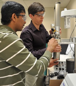 <p>Dr. Alex Agrios (right) and Civil and Environmental Engineering graduate student Venkata Manthina, set up a new high pressure reactor in the C2E2 lab. Photo by Brianna Diaz</p>