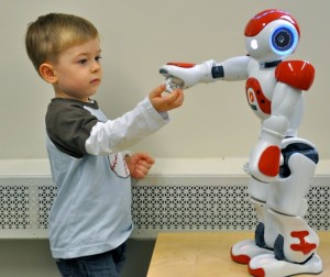<p>Aiden Krane, age 3, with robot. Photo by Sheila Perretta</p>