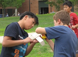 <p>Budding pilots worked together to prepare a plane for flight. The students not only captured the action on video, they learned some laws and principles of physics and chemistry while they were at it. Photo by Sheila Foran</p>