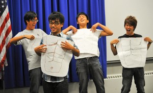 <p>How many meanings does "six pack" have in English? These UCAELI students from Taiwan show off their newly acquired English language skills at closing ceremonies. Photo by Peter Morenus</p>
