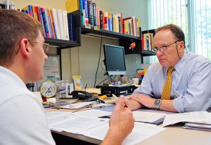 <p>Career Counselor Dennis M. Rouelle talks over a resume with Steve Miske, a senior history and political science major at the Department of Career Services. Photo by Jessica Tommaselli</p>
