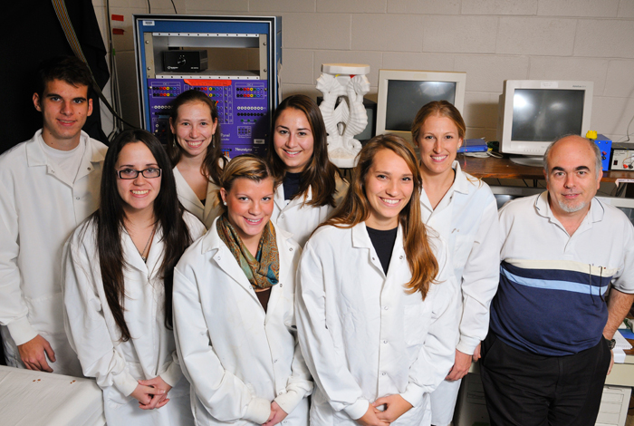 <p>Etan Markus (far right) in his lab with his students: (back row, from left) Matt Howe, a Physiology and Neurobiology and Psychology junior, Sara Pallay, a Pre Veterinarian junior, Stephanie Bohannon, a Psychology and Political Science junior, and Nickie Paul, a Behavioral and Neurological Sciences graduate student; (front row, from left) Brandy Schmidt a Behavioral and Neurological Sciences graduate student, Melissa Argraves, a Psychology Senior, and Emily Szkudlarek a Psychology junior. Photo by Jessica Tommaselli.</p>
